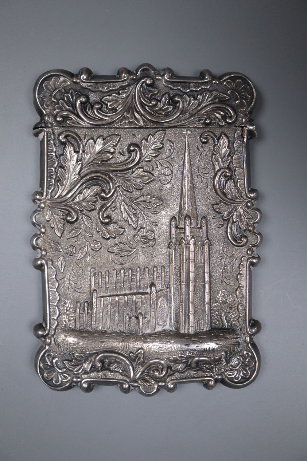 A 19th century white metal card case, the front and back embossed with Ganymede & the Eagle and cathedral, unmarked,